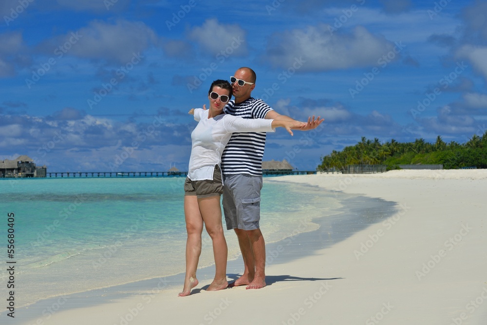 happy young couple have fun on beach