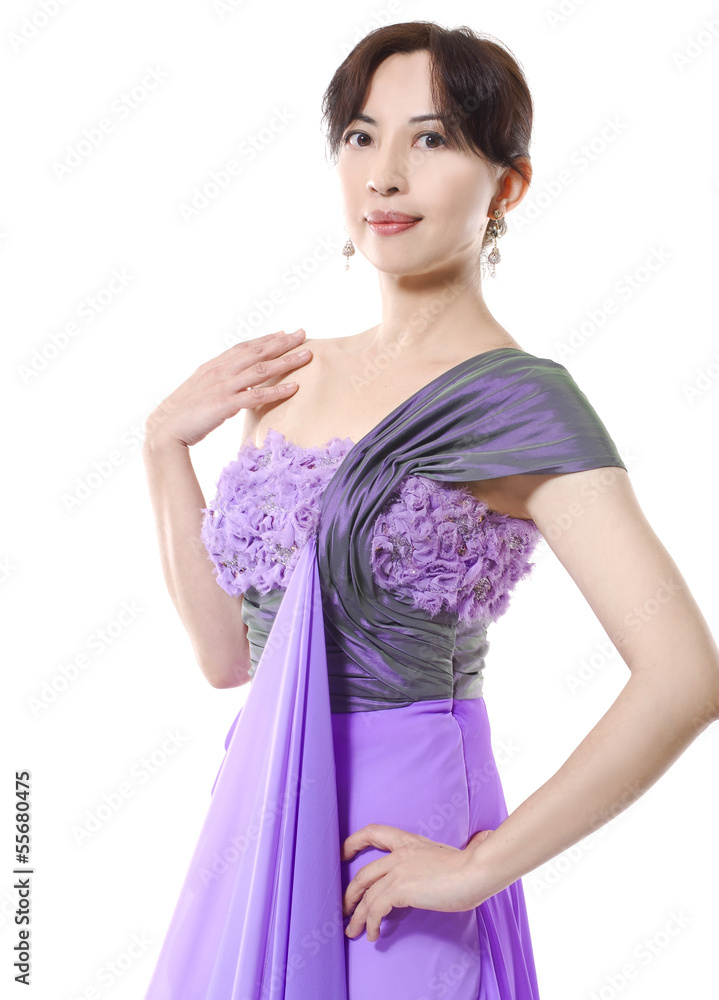 Beautiful luxurious woman posing in purple dress Beautiful luxurious woman posing in purple dress