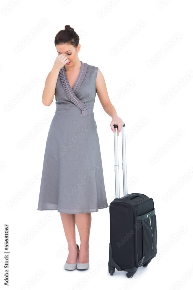 Gorgeous woman with suitcase having headache Gorgeous woman with suitcase having headache