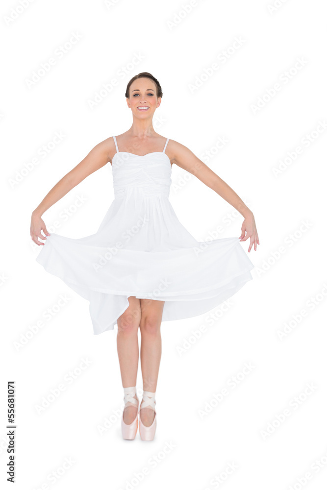 Cheerful young ballet dancer isolated