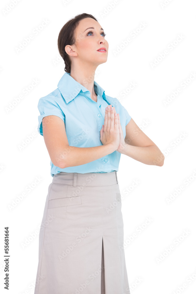 Worried young businesswoman praying Worried young businesswoman praying