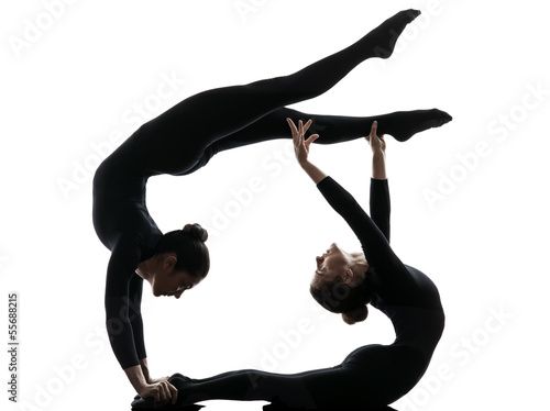 Schilderij op canvas two women contortionist  exercising gymnastic yoga silhouette