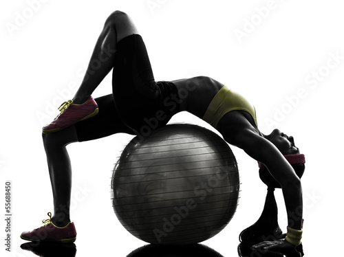 supple woman exercising fitness  ball workout  silhouette