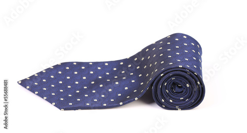 Blue male tie with white pattern rolled