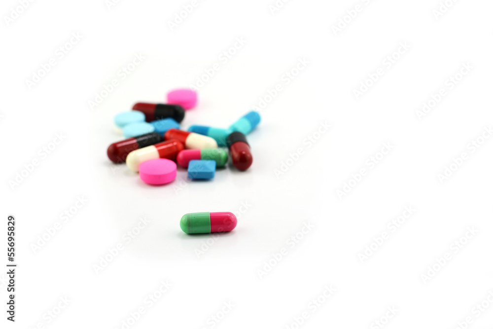 Colorful medical pills and capsules on white background. Colorful medical pills and capsules on white background.