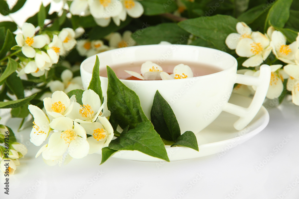 Cup of tea with jasmine, isolated on white Cup of tea with jasmine, isolated on white