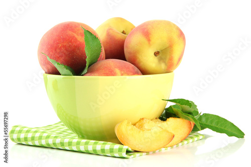 Ripe sweet peaches in bowl  isolated on white