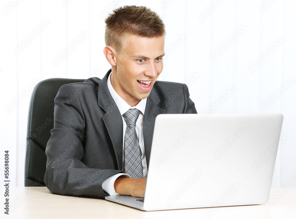 Portrait of young businessman working in office Portrait of young businessman working in office