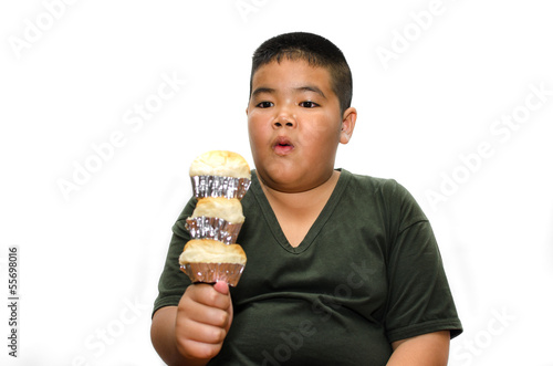 Hungry obese fat boy child with Many bread photo