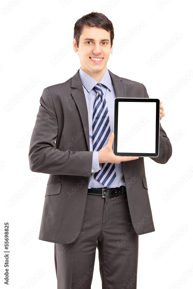 Smiling businessman in suit showing a tablet Smiling businessman in suit showing a tablet
