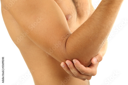 Young man with hand pain, isolated on white © Africa Studio