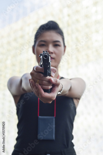 Beautiful Asian policewoman in action.