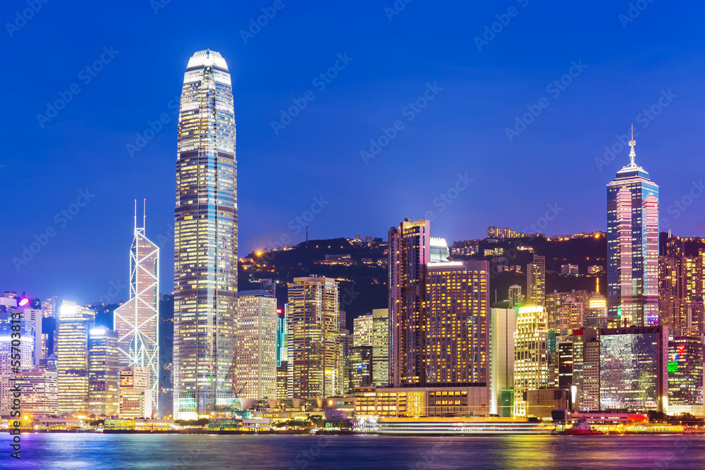 Hong Kong city skyline at night with Victoria Harbor and skyscra