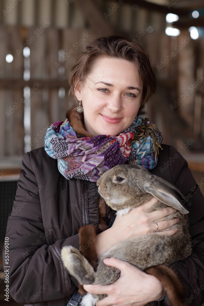 Woman holding rabbit