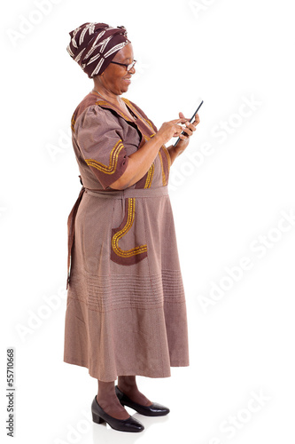 side view of african woman using tablet computer
