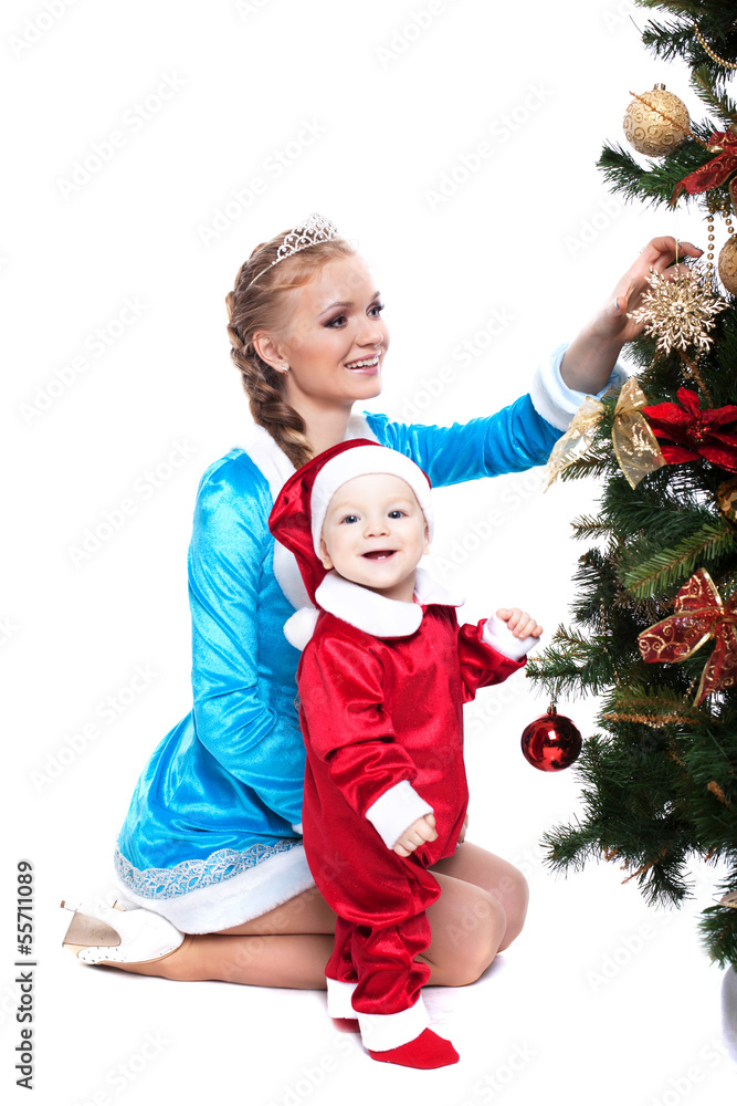 Smiling mother and baby posing in Xmas costumes Smiling mother and baby posing in Xmas costumes
