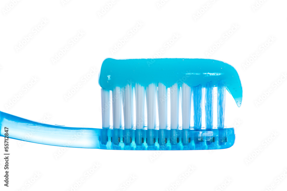 One toothbrush with toothpaste over white background One toothbrush with toothpaste over white background