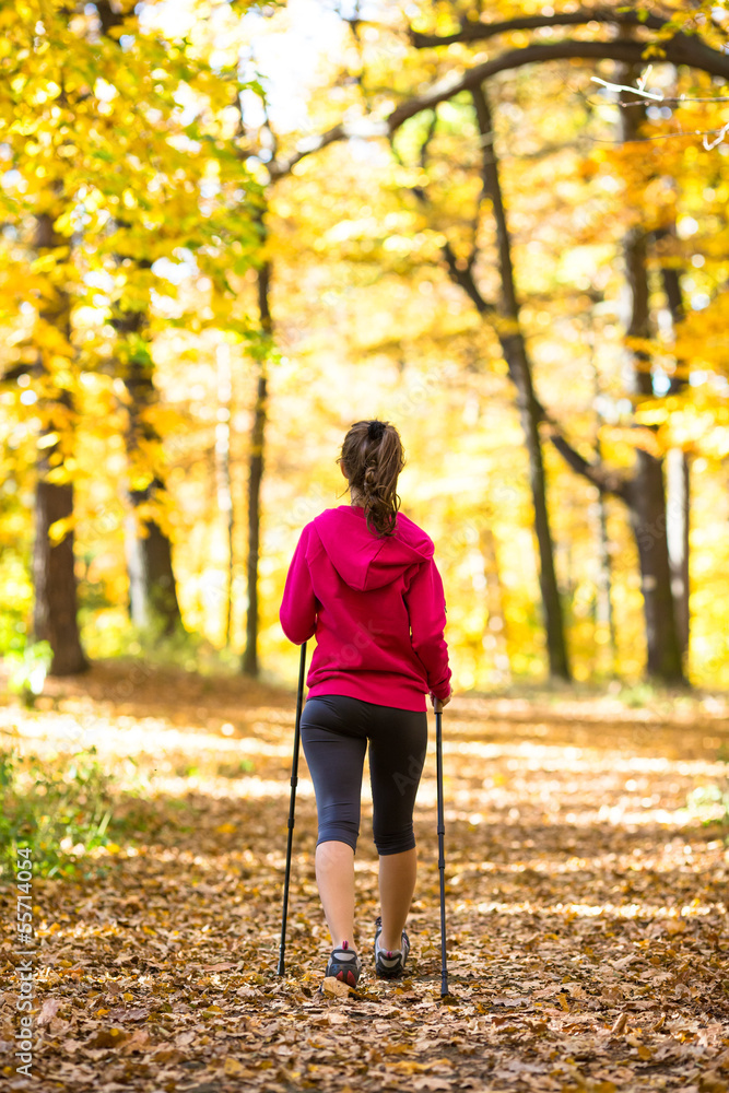 Obraz premium Nordic walking - active girl outdoor