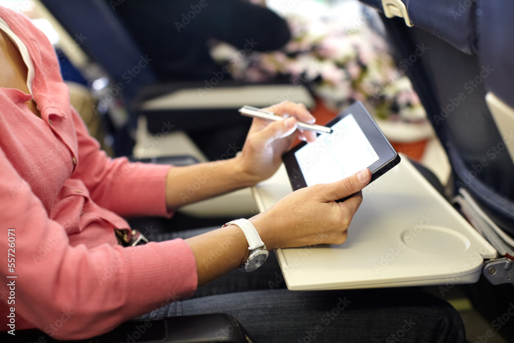 Hands with tablet computer.