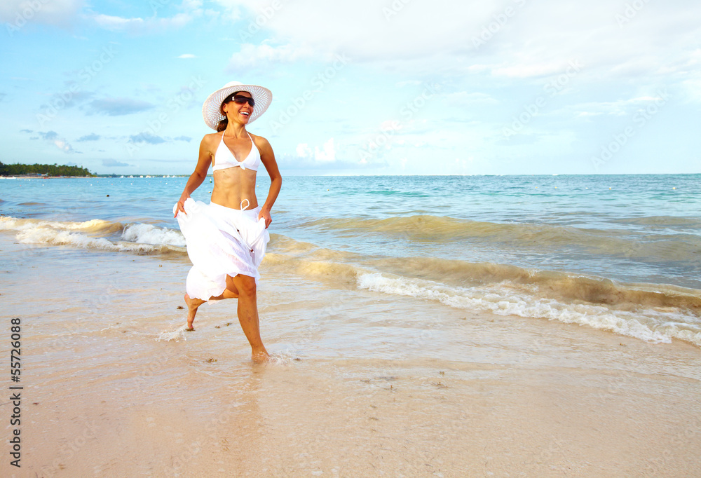 Happy woman on Punta Cana beach.