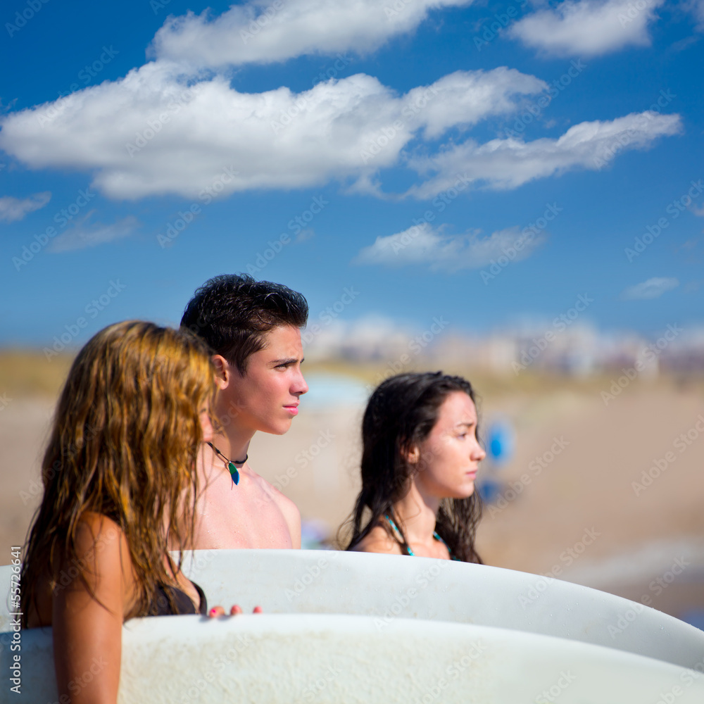 Teenager surfers group happy in beach shore Teenager surfers group happy in beach shore