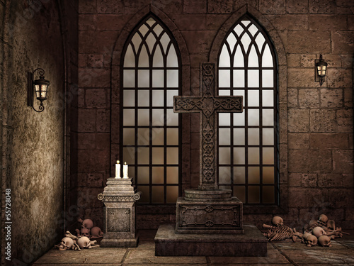 Gotycka krypta z czaszkami, świecami i lampami