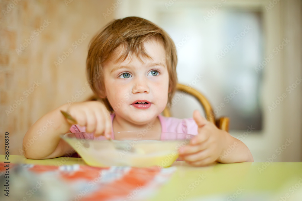 child eats  in home