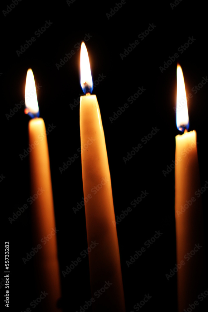 Three Candles On A Black Background Three Candles On A Black Background