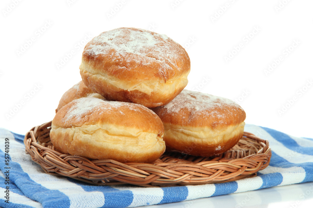 Tasty donuts on wicker plate, isolated on white Tasty donuts on wicker plate, isolated on white