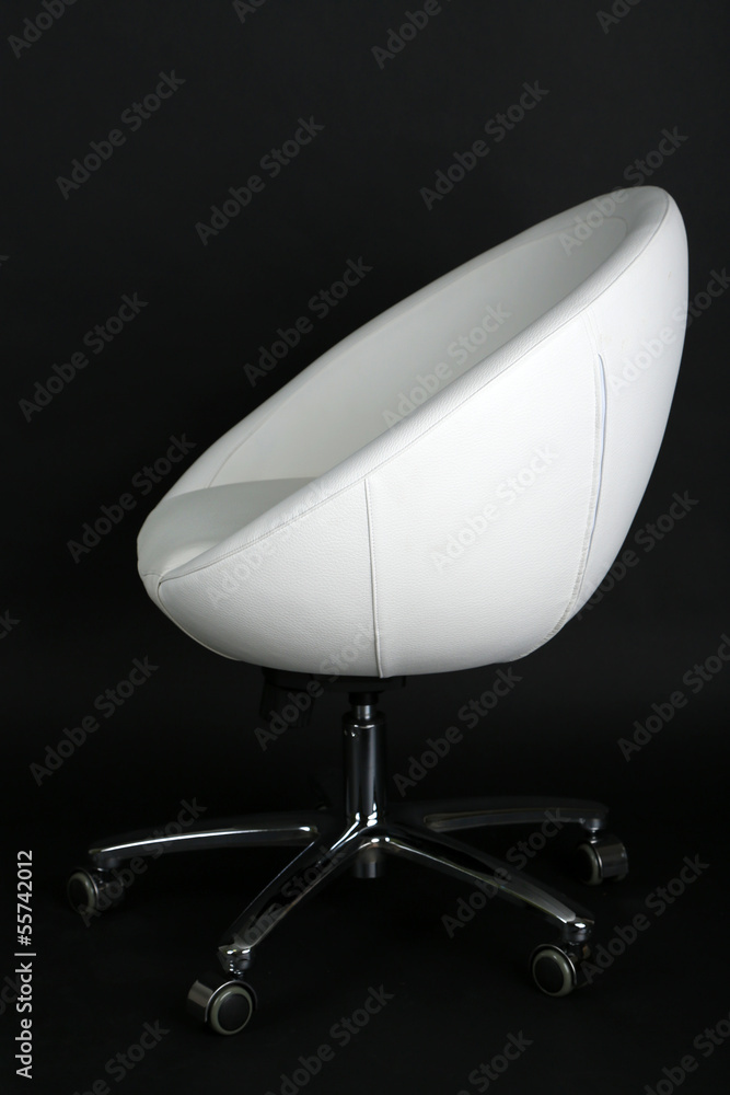 Fototapeta premium White chair on black background