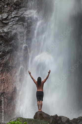 Man at waterfall