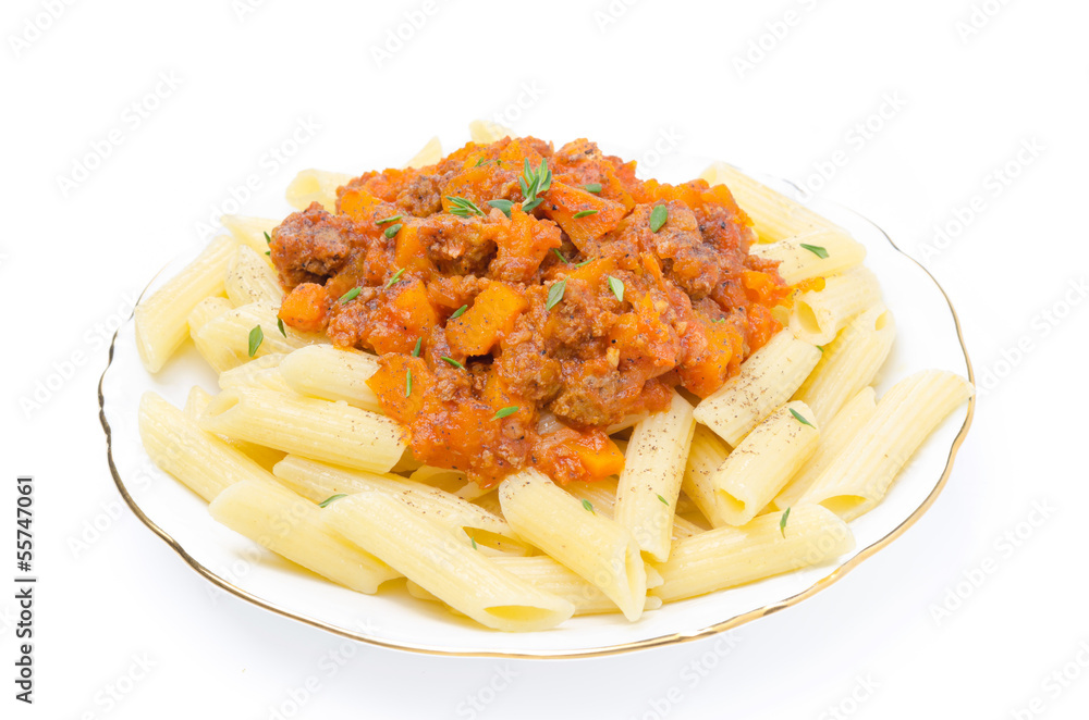 penne pasta with sauce of beef, tomato and pumpkin on a plate penne pasta with sauce of beef, tomato and pumpkin on a plate