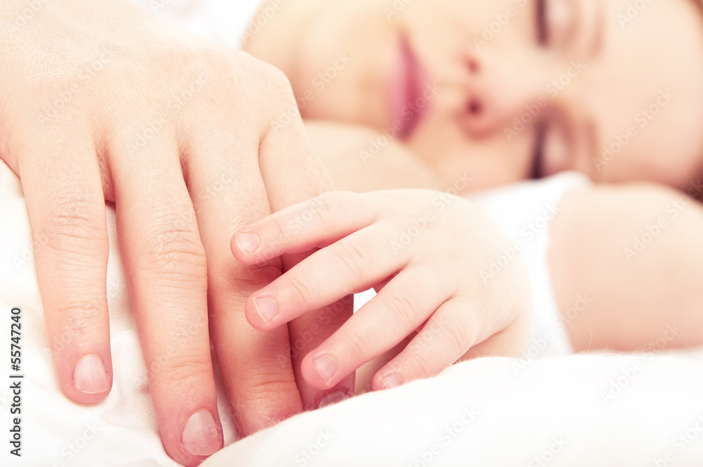 hand the sleeping baby in the hand of mother hand the sleeping baby in the hand of mother