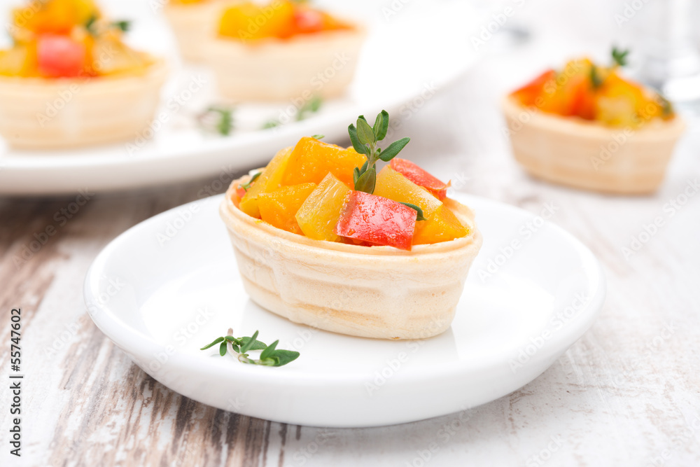 tartlet with roasted vegetables on a plate tartlet with roasted vegetables on a plate