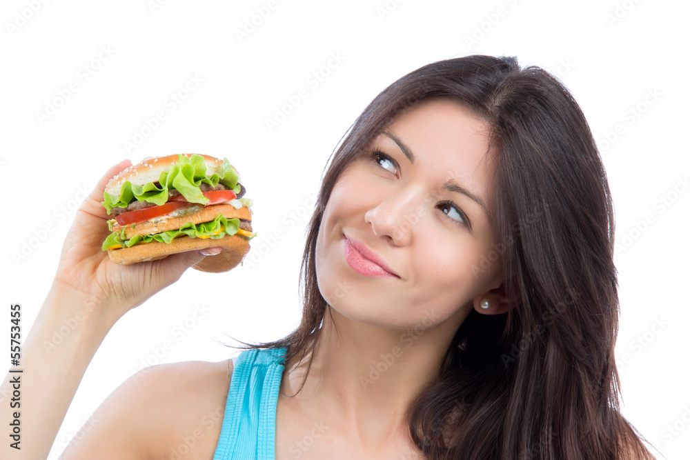 woman with tasty fast food unhealthy burger in hand to eat