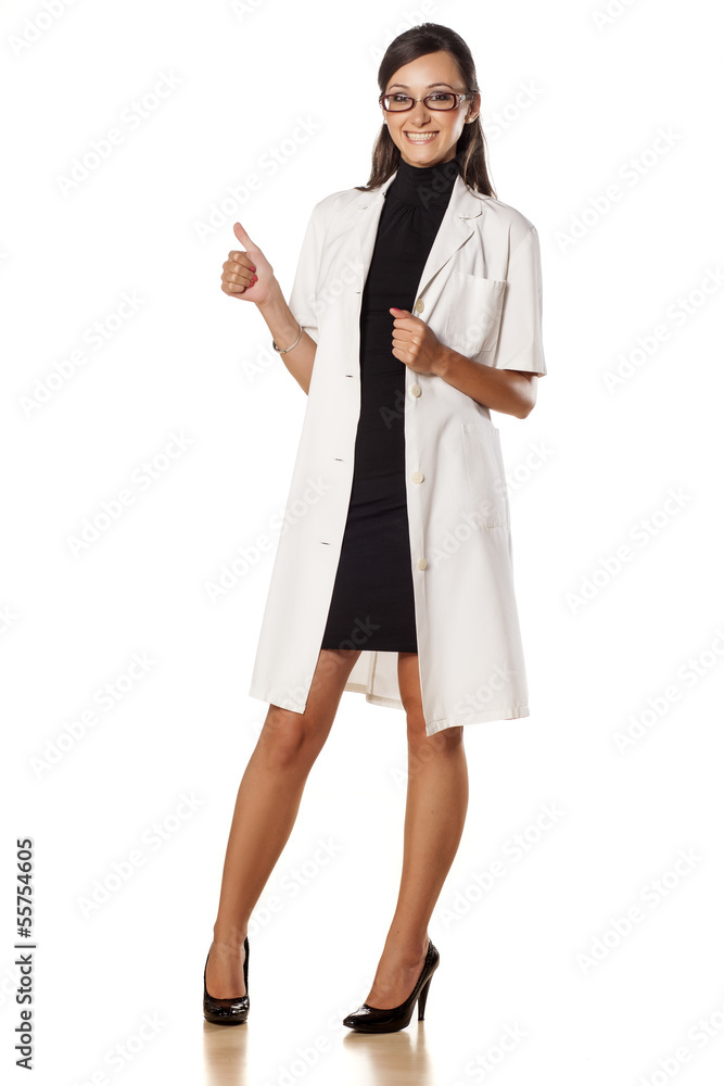 smiling pretty young woman doctor showing thumbs up smiling pretty young woman doctor showing thumbs up