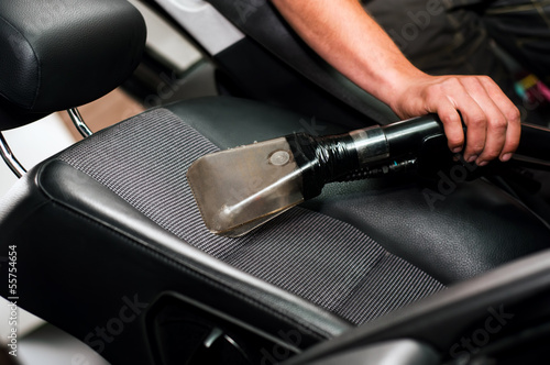 Auto car service cleaning the drivers seat, clealing and vacuumi © aboutmomentsimages