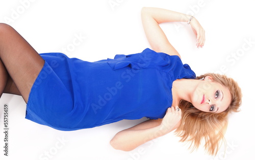 woman lying lovely girl in blue dress over white