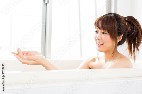 beautiful asian woman relaxing in the bath room