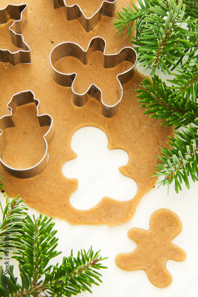 Gingerbread dough for Christmas cookies and cookie cutters. Gingerbread dough for Christmas cookies and cookie cutters.