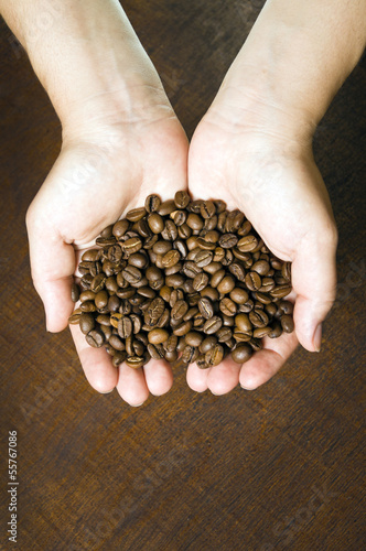 Young girl holding coffee beans