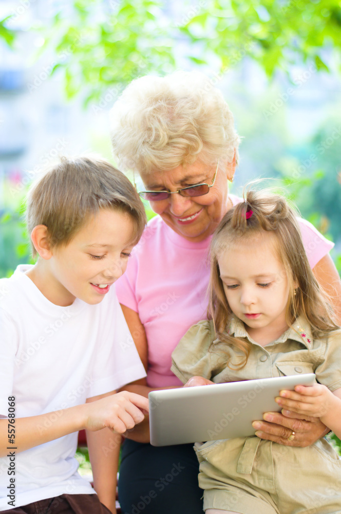 grandmother with grandchildren using tablet grandmother with grandchildren using tablet