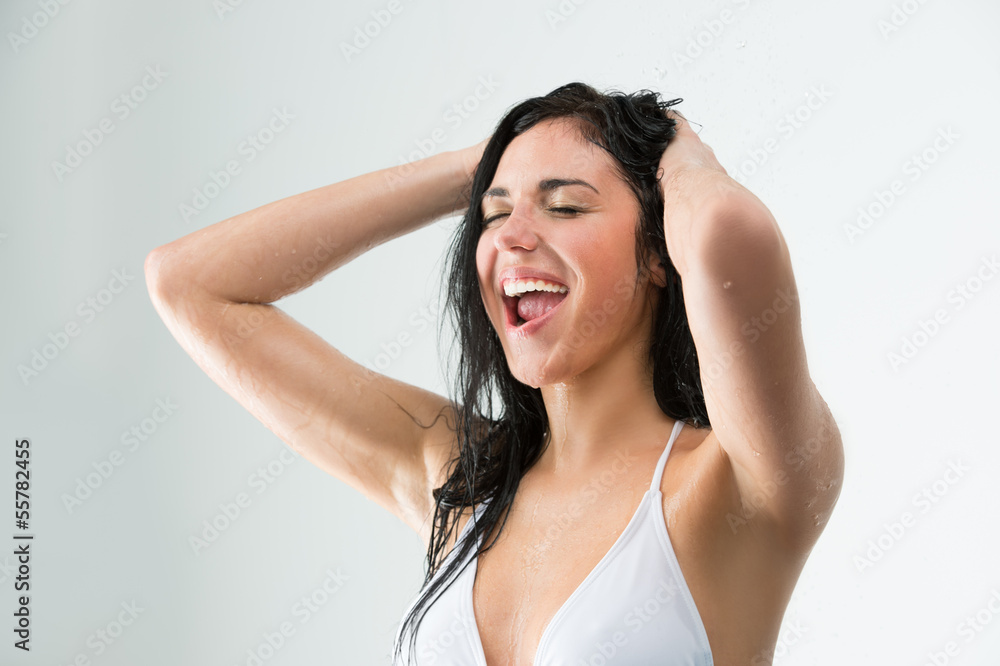 Woman showering with happy smile and water splashing Woman showering with happy smile and water splashing