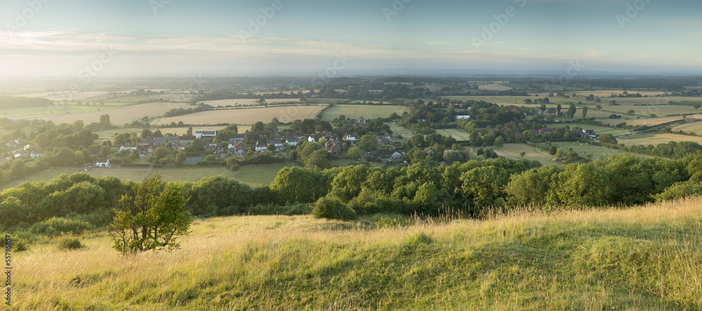 View across English countryside landscape during late Summer eve