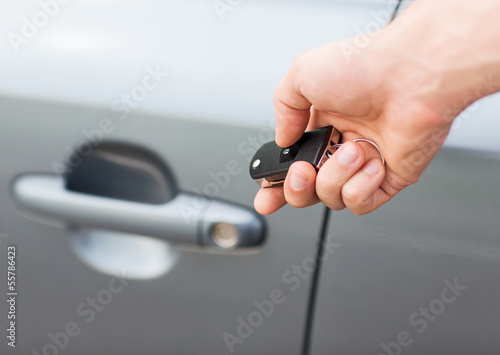 man with car key outside © Syda Productions