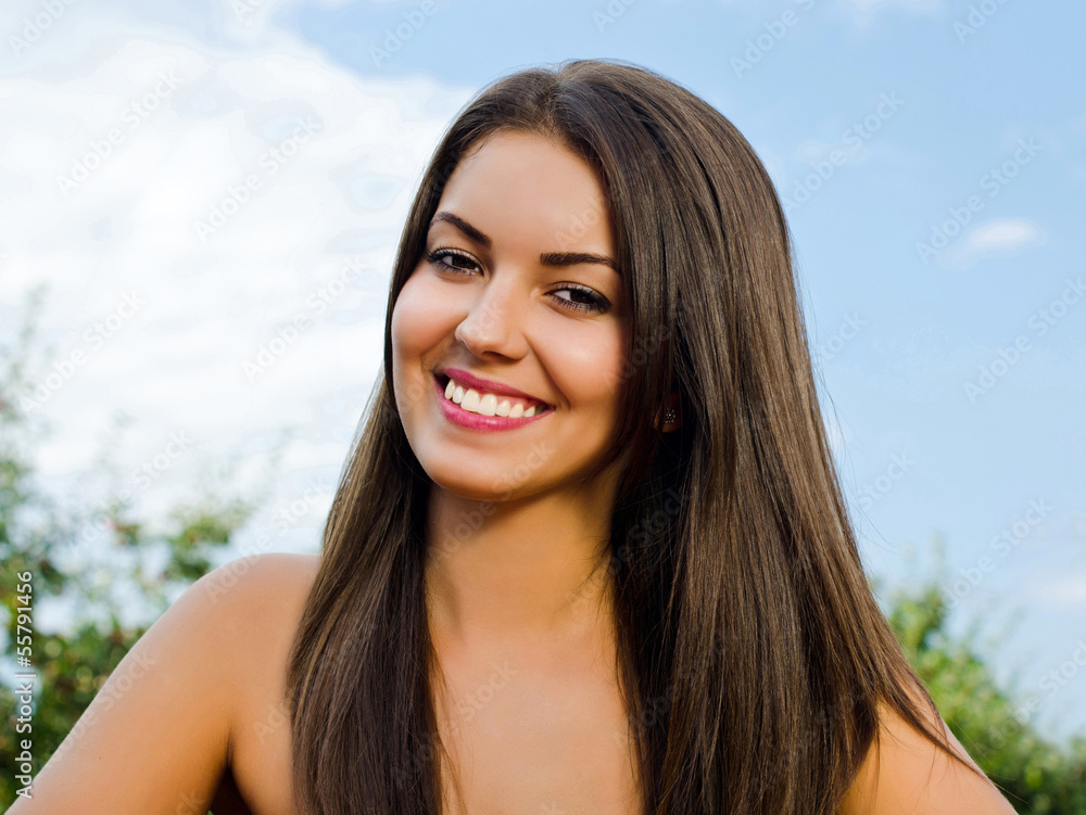 Portrait of a beautiful woman in the garden on a summer day Portrait of a beautiful woman in the garden on a summer day