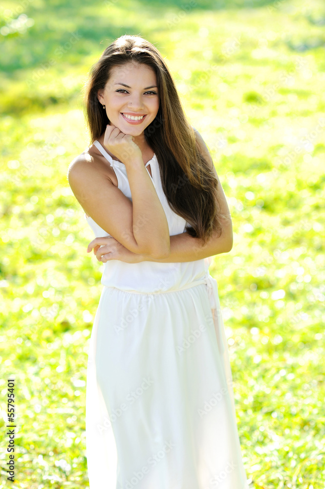 Portrait of young beautiful woman in a park Portrait of young beautiful woman in a park