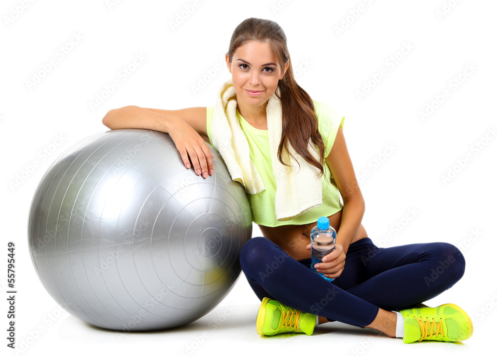 Young beautiful fitness girl with grey ball isolated on white Young beautiful fitness girl with grey ball isolated on white