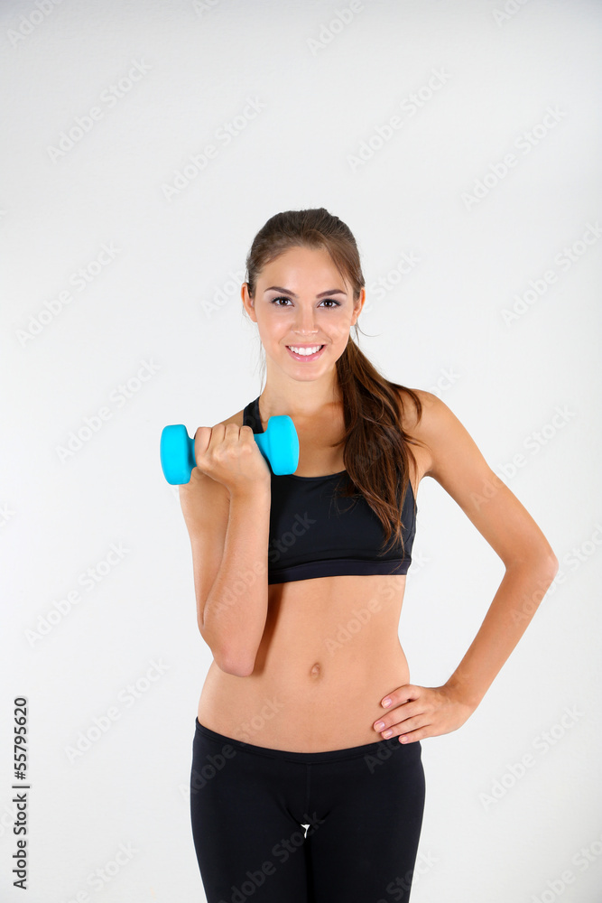 Beautiful young girl doing exercises at home Beautiful young girl doing exercises at home