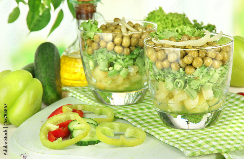Tasty salad with fresh vegetables on wooden table Tasty salad with fresh vegetables on wooden table